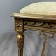 Antique gilded wooden bench in Louis XVI style, 19th century.