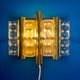 HANS AGNE JAKOBSSON. A pair of glass and brass wall lights