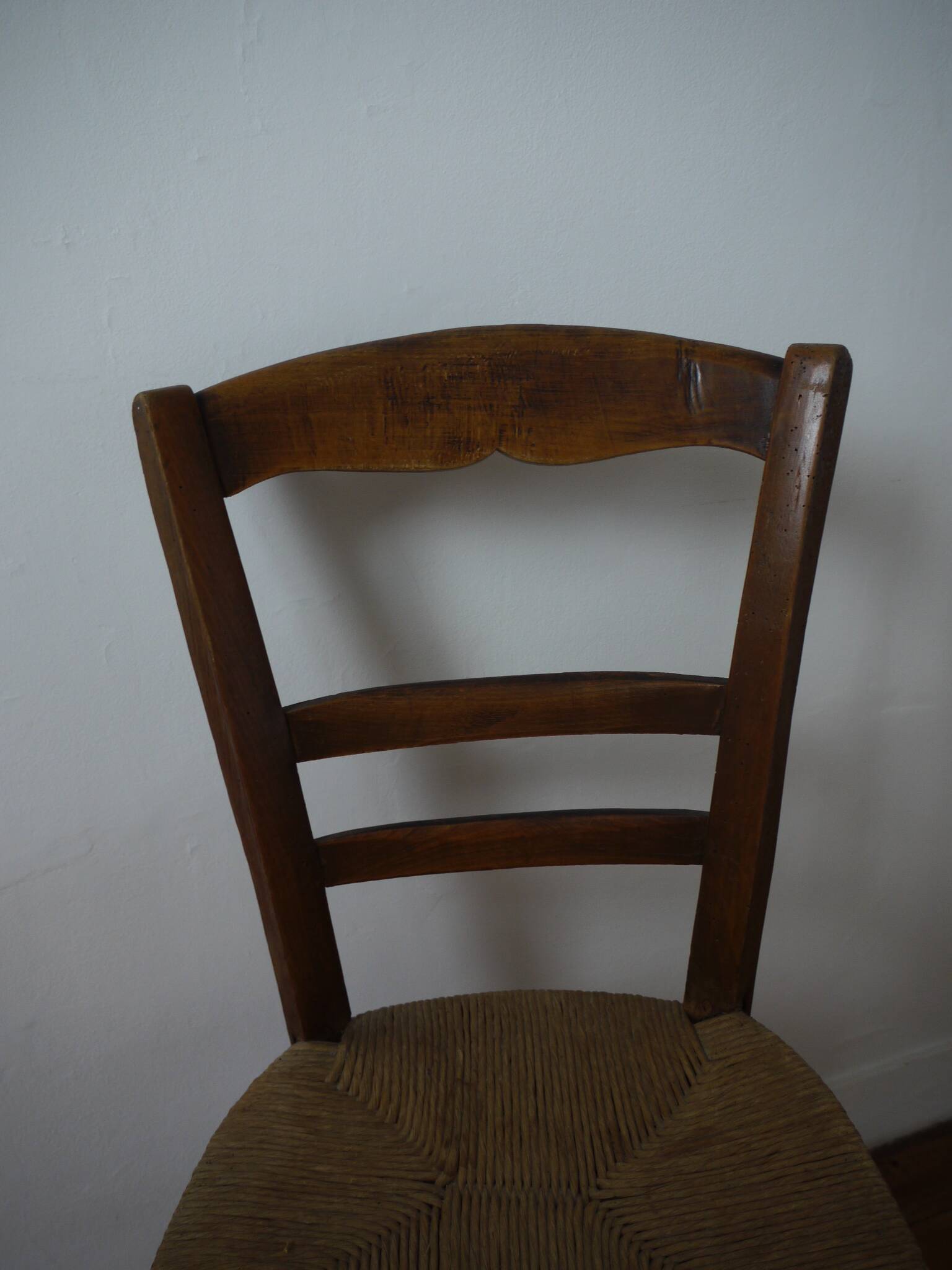 Wooden chair with straw seat