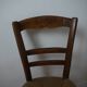 Wooden chair with straw seat