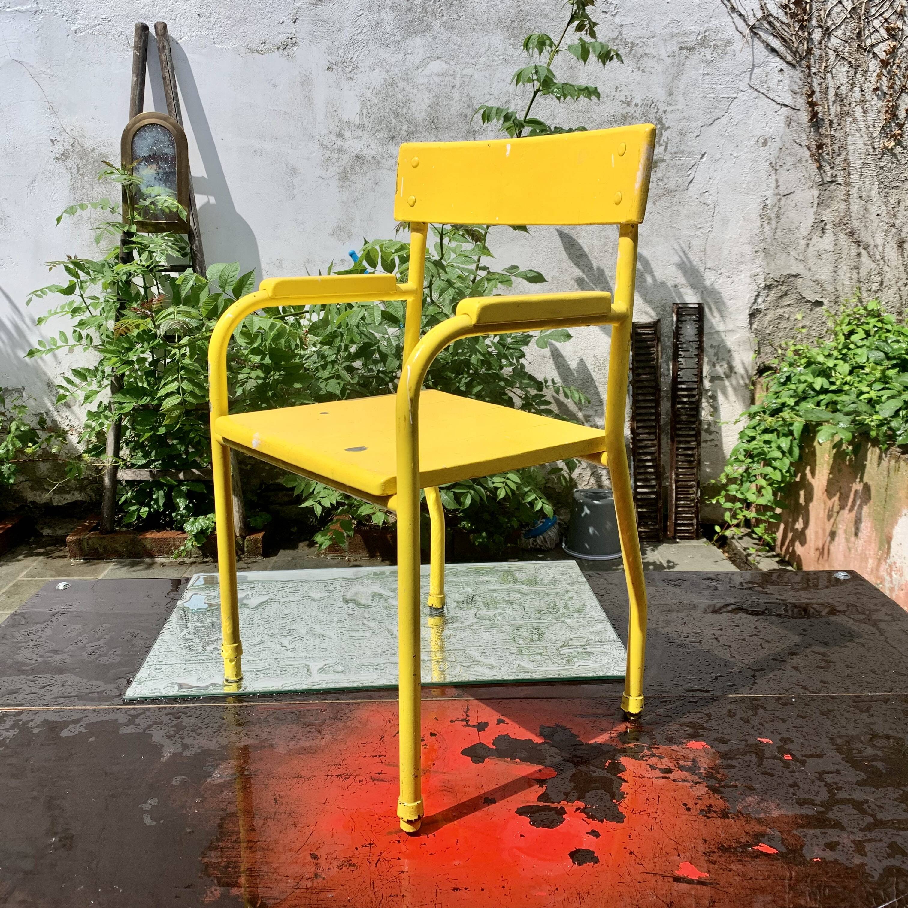 Vintage children's chair in yellow painted wood and metal