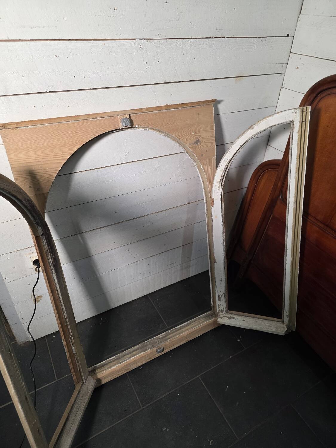 Old arched window made of fir wood