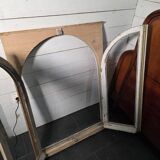 Old arched window made of fir wood