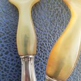 Corn and silver metal salad cutlery