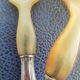 Corn and silver metal salad cutlery