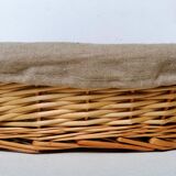 Braided rattan pan-maker bread basket covered with linen fabric