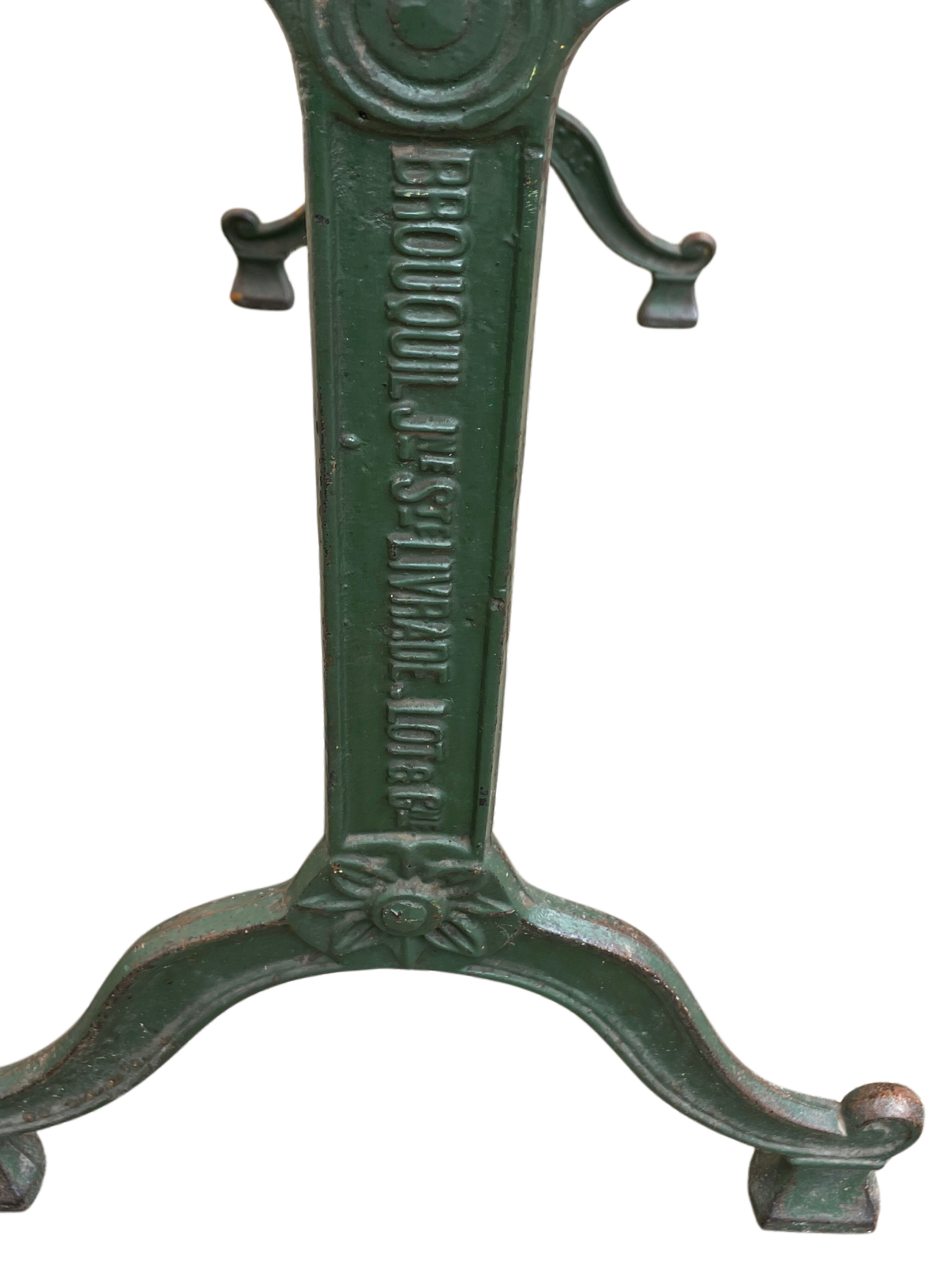 Old bistro table in engraved wrought iron