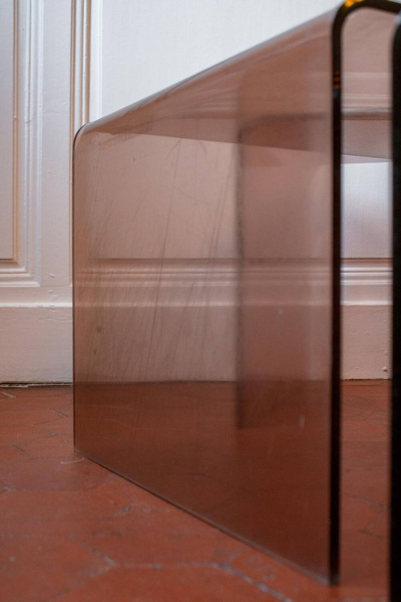 Vintage trio of nesting tables in smoked plexiglass by Michel Dumas, year.