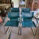 4 vintage Italian armchairs in green leather and chrome metal.