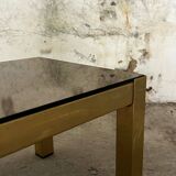 Trio of nesting tables, brass structures and smoked mirror tops