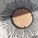 Black metal sunburst wall mirror, round 63x63 cm, vintage 1990s, made in Italy