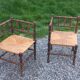 Pair of angled armchairs with turned wood and rush seats from the 1960s.