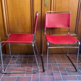 2 tubular chairs in red leather 1970