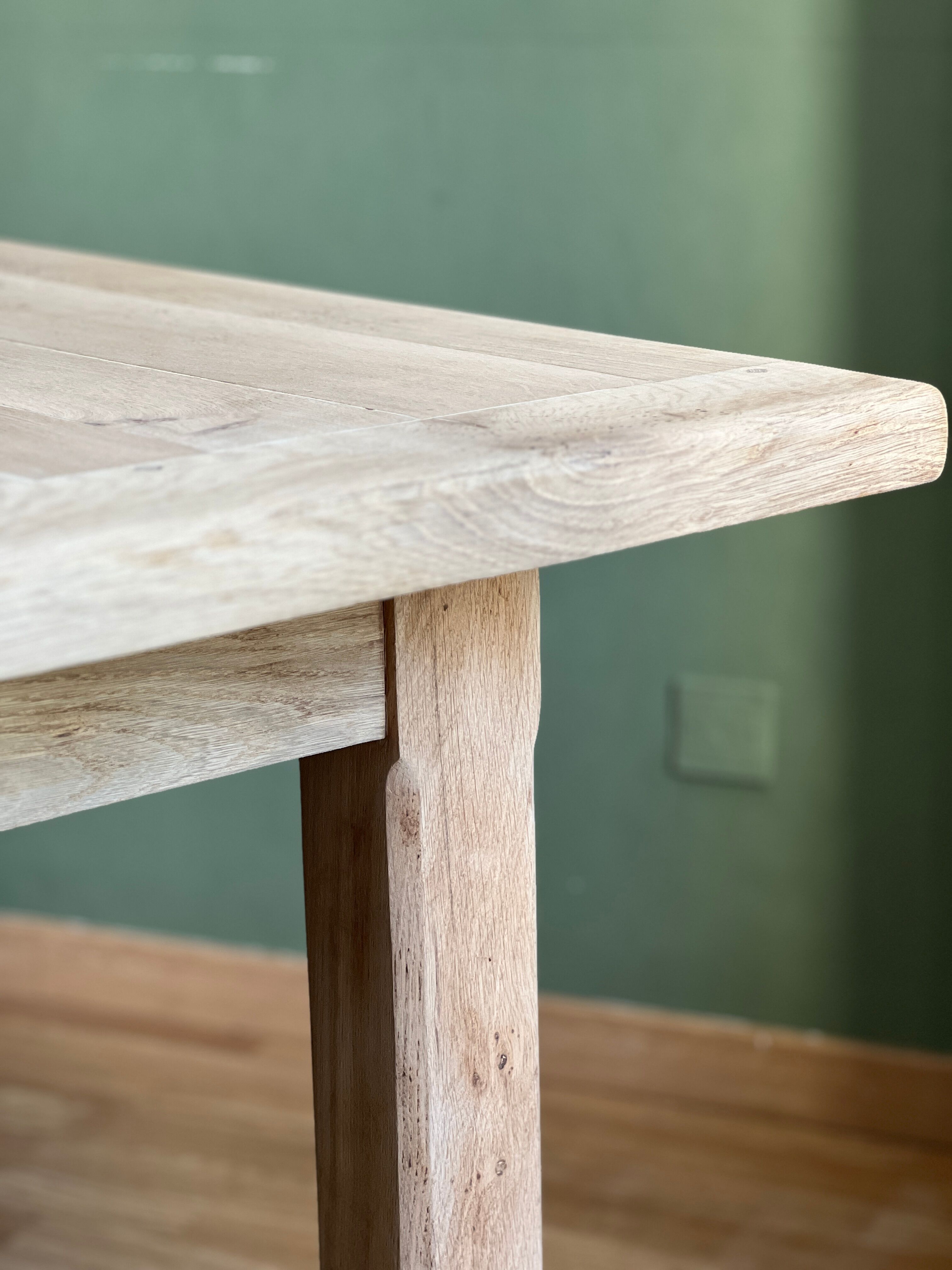Farm table made of solid light oak wood.