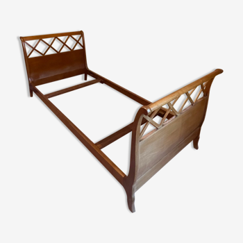 Wooden bed with brace