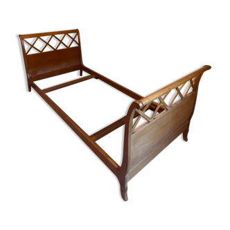 Wooden bed with brace