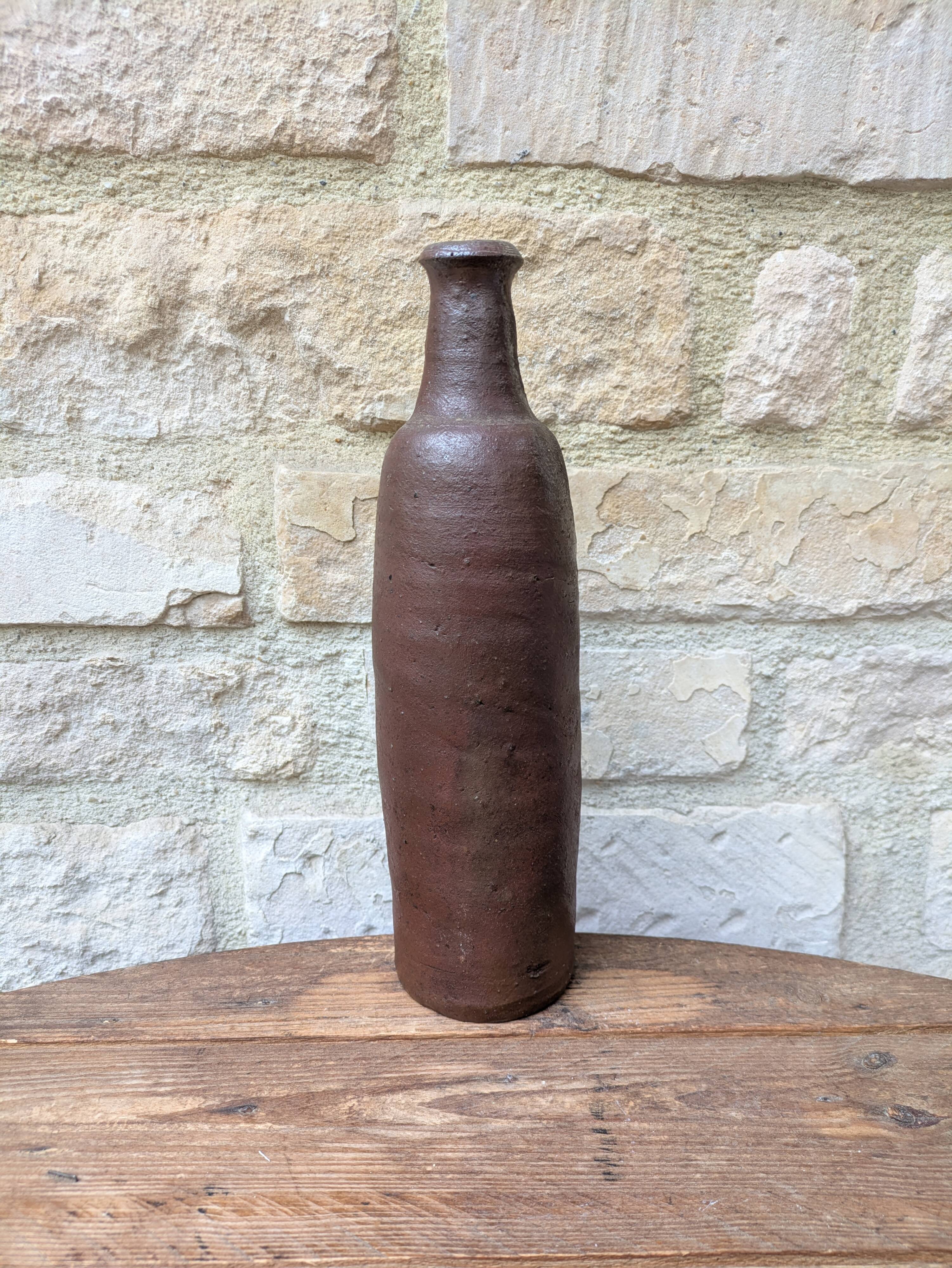 Old handmade terracotta bottle