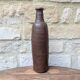 Old handmade terracotta bottle