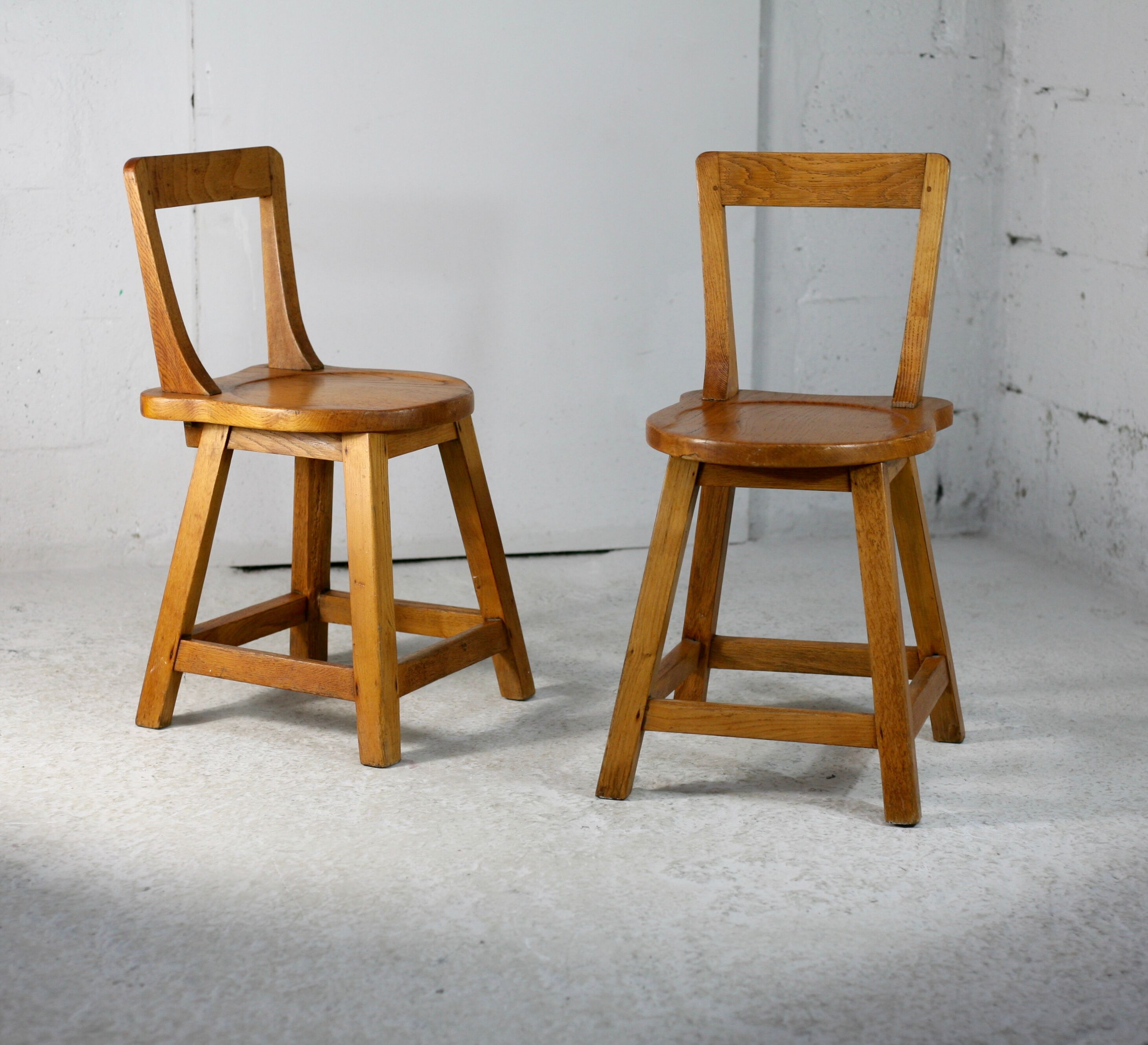 Pair of brutalist wooden back stools. France, circa 1960
