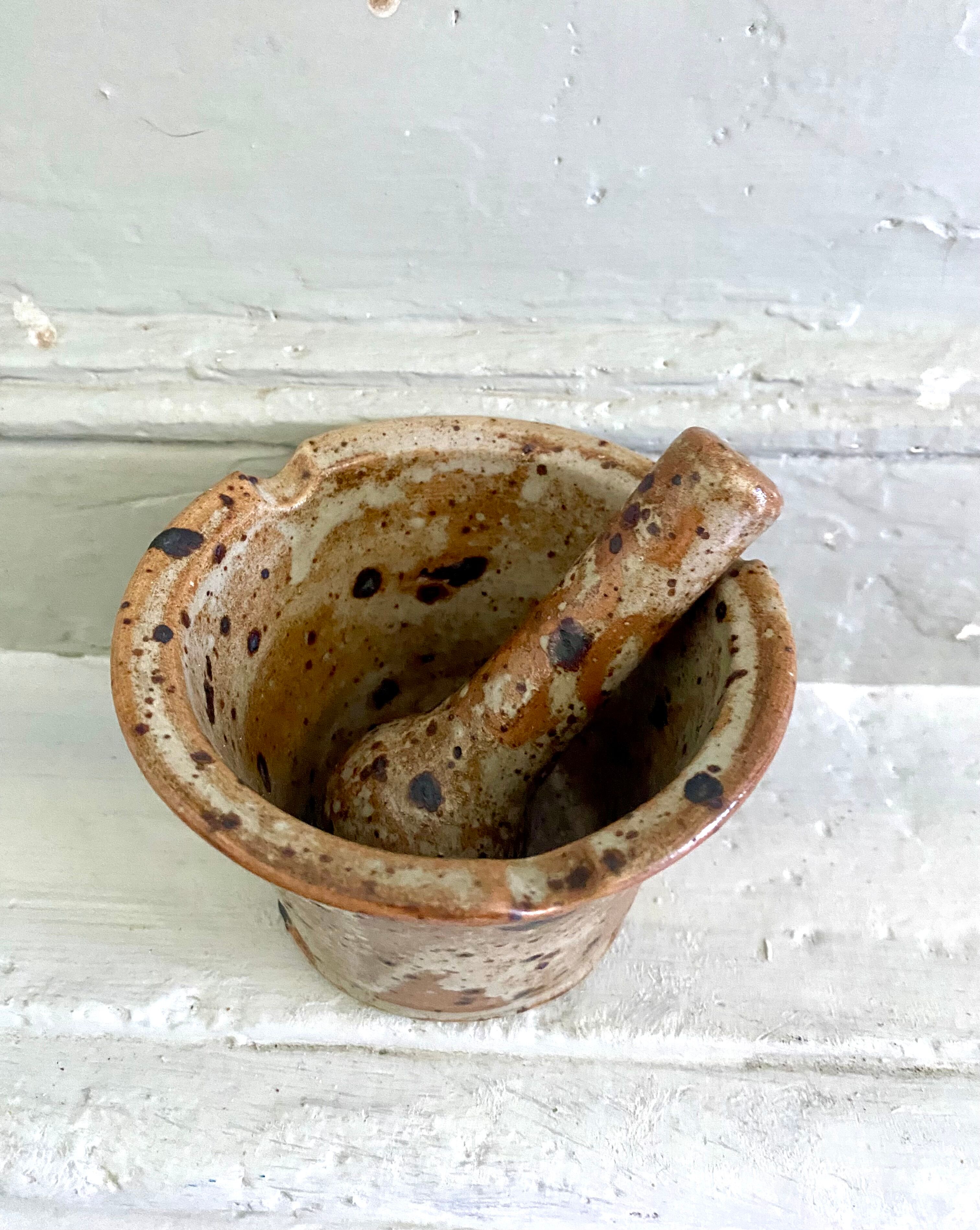 Pyrite sandstone mortar and its pestle