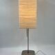 Vintage table lamp made of crumpled rice paper, with a matte metal base.