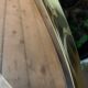 Vintage smoked oval wall mirror
