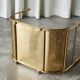 Sculptural brass magazine rack or basket from the 1970s.