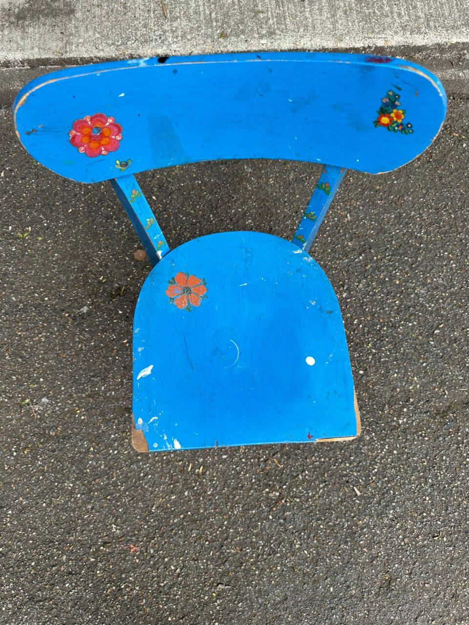 Child's chair in vintage or rustic wood style from the 1960s.