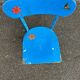 Child's chair in vintage or rustic wood style from the 1960s.