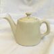 "Selfish" cream-colored teapot