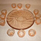 12 shot glasses on pink glass tray