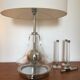 Serie of three candlesticks in Plexiglas and metal 1970