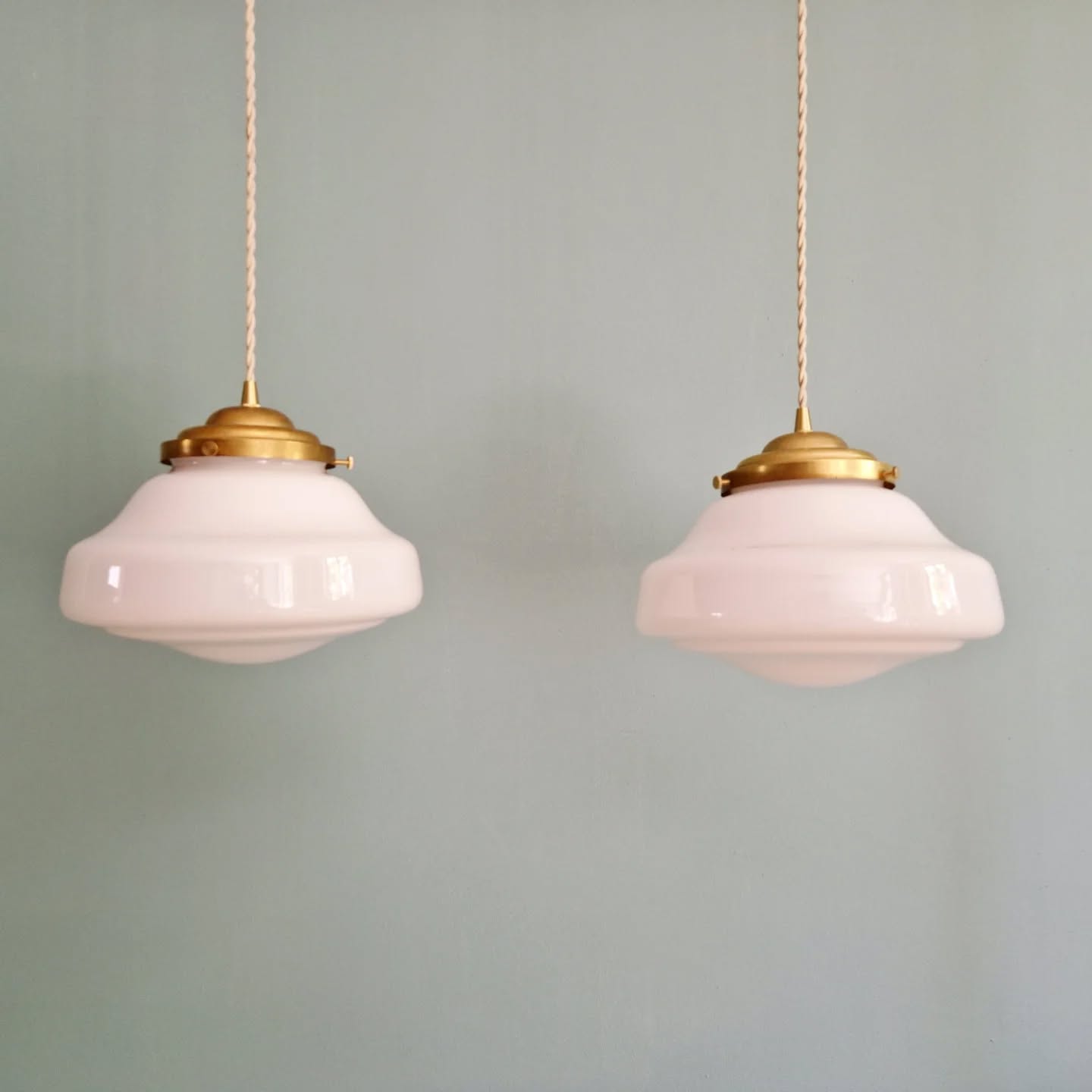 Pair of Art Deco pendant lights in white opaline.