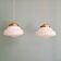 Pair of Art Deco pendant lights in white opaline.