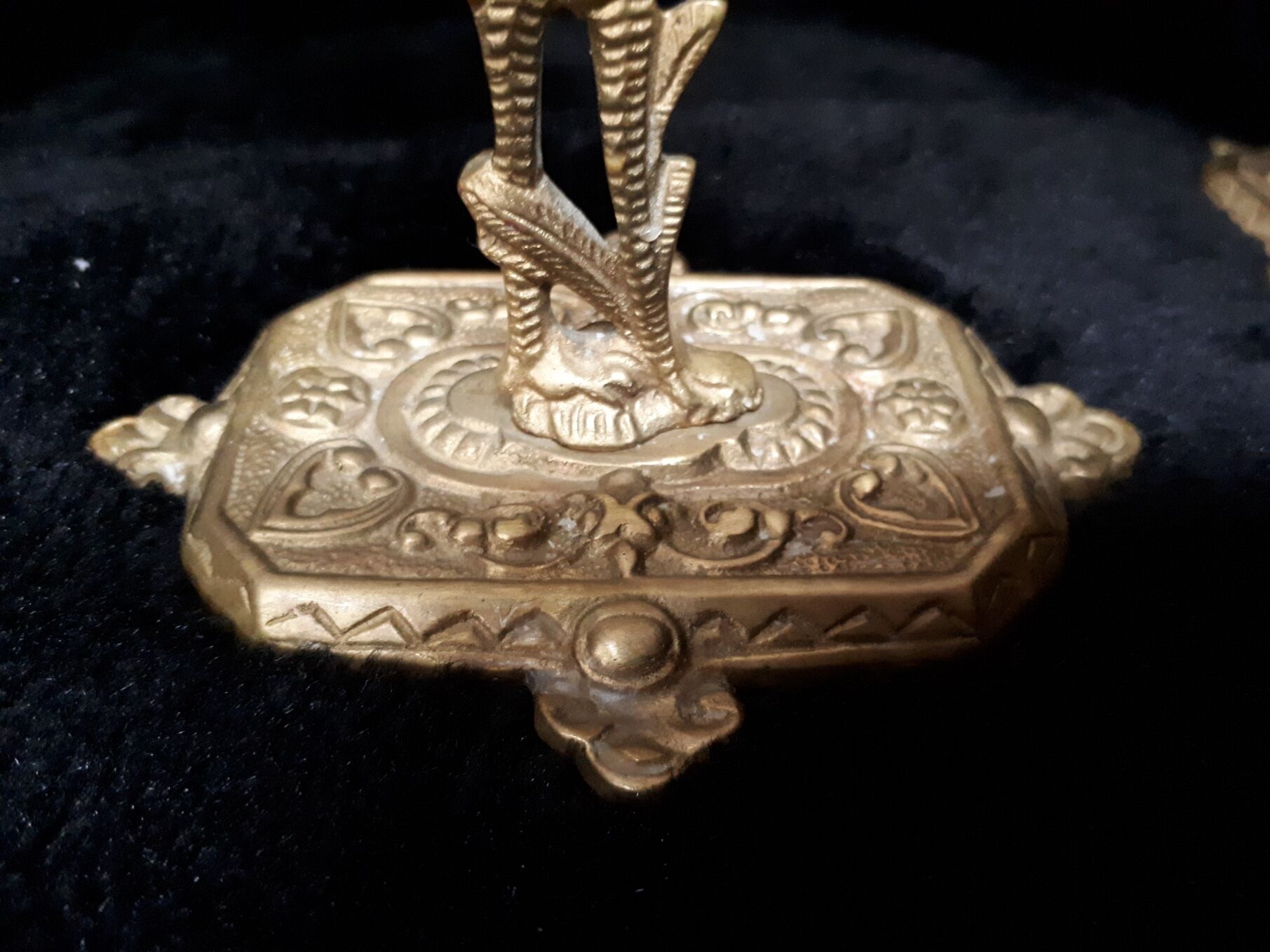 Pair of bronze candle holders decorated with herons