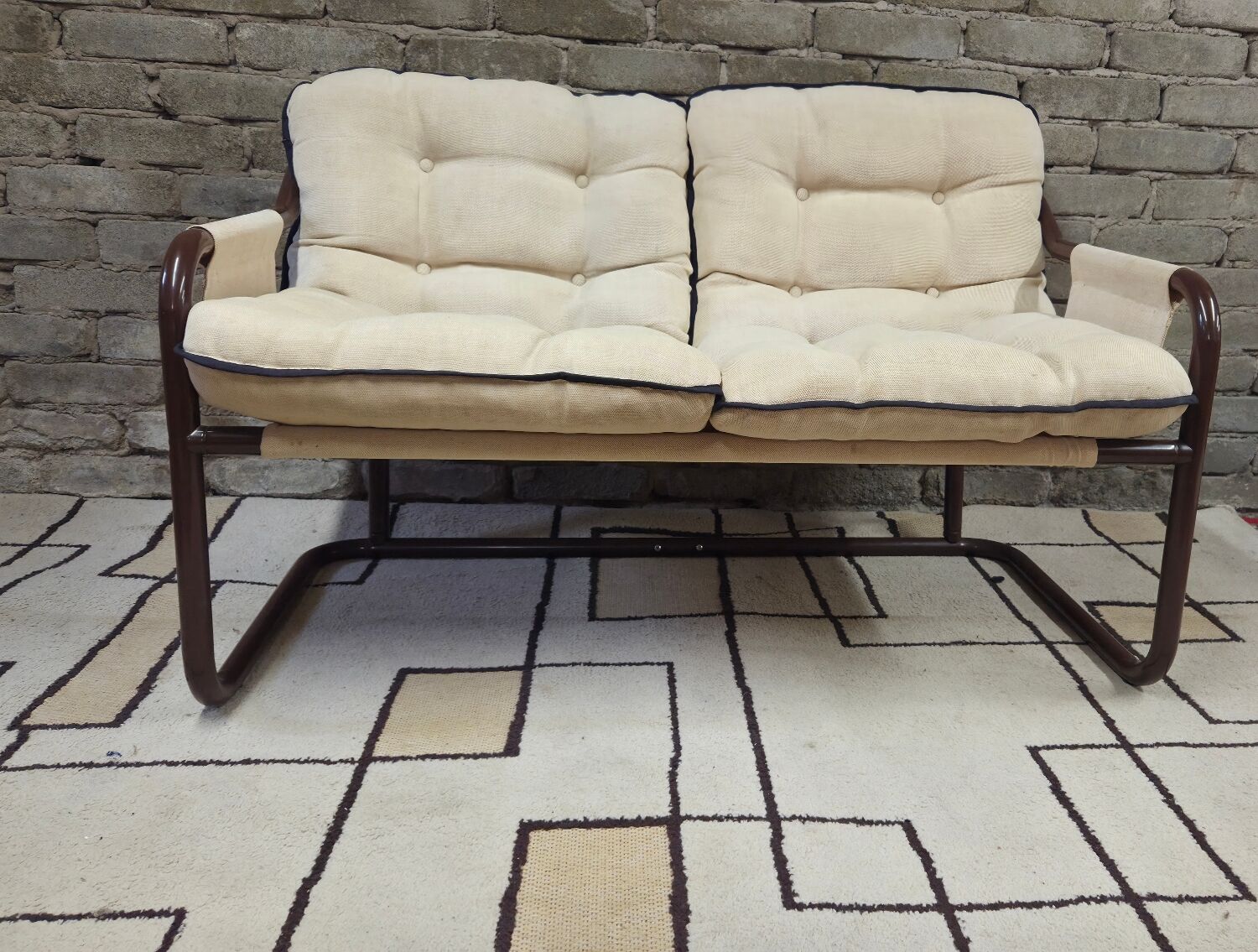 Tubular two-seater bench from the 1970s.