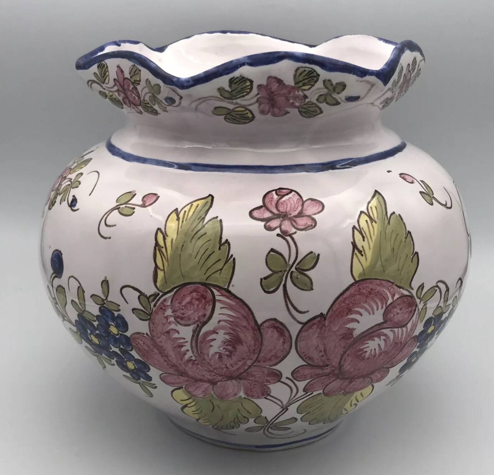 Round earthenware vase with polychrome floral motifs, signed