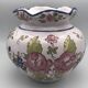 Round earthenware vase with polychrome floral motifs, signed