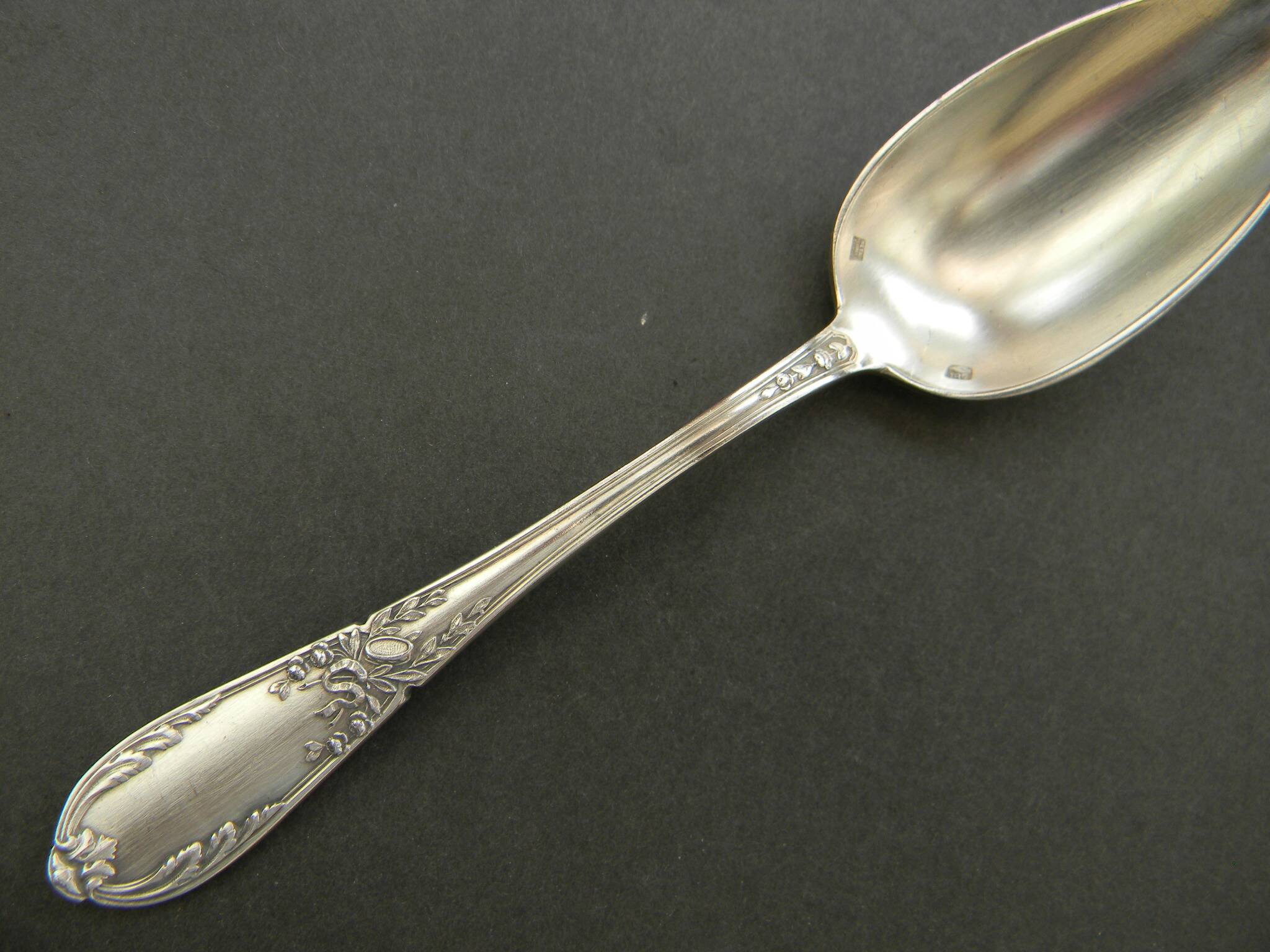 Set of 11 SFAM silver metal teaspoons.