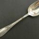 Set of 11 SFAM silver metal teaspoons.