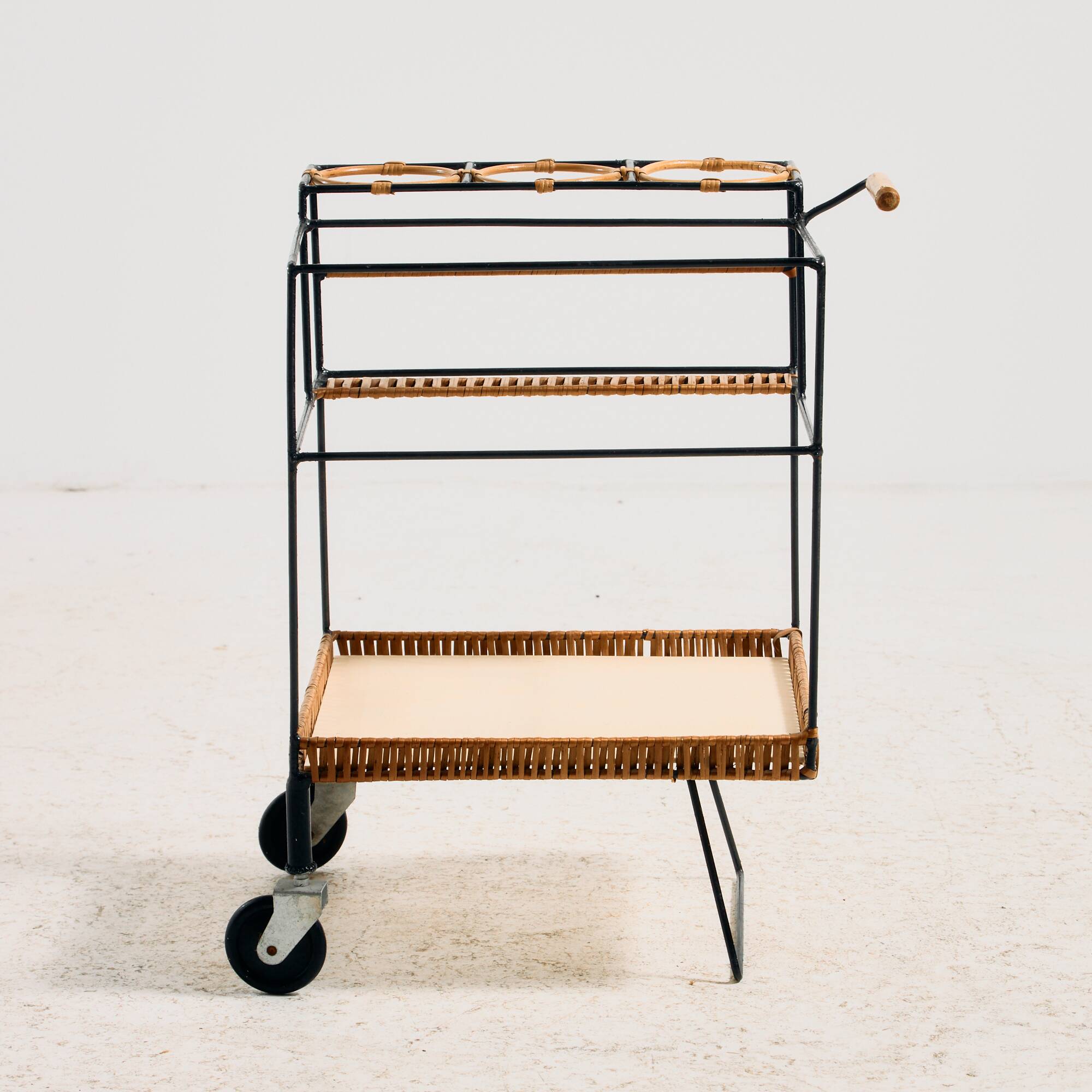 Metal cart with bamboo and wicker details.