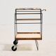 Metal cart with bamboo and wicker details.