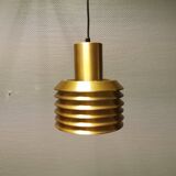 Hanging lamp in gold-colored aluminum with many layers of shades.