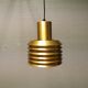 Hanging lamp in gold-colored aluminum with many layers of shades.