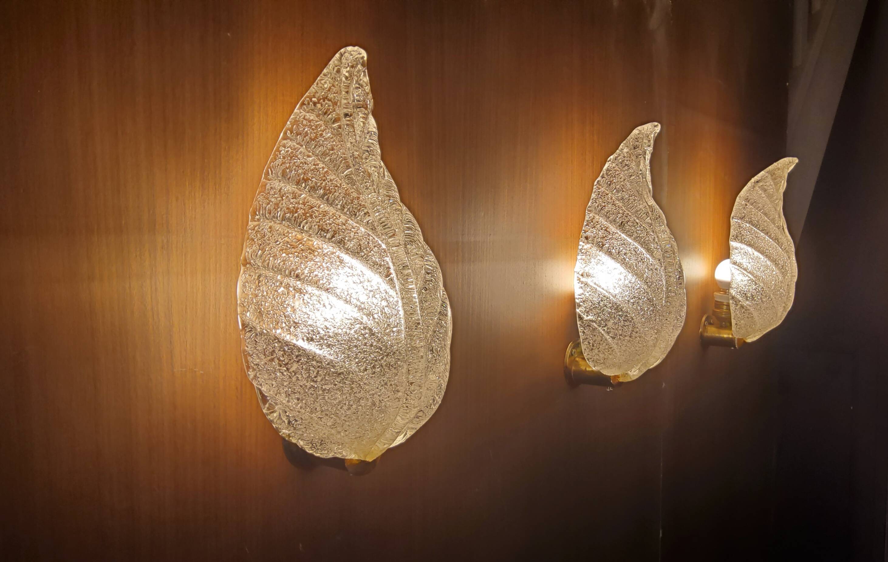 Murano, leaf sconces in worked transparent glass, 1940s