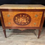 Louis XVI style commode inlaid with a decoration of instruments.