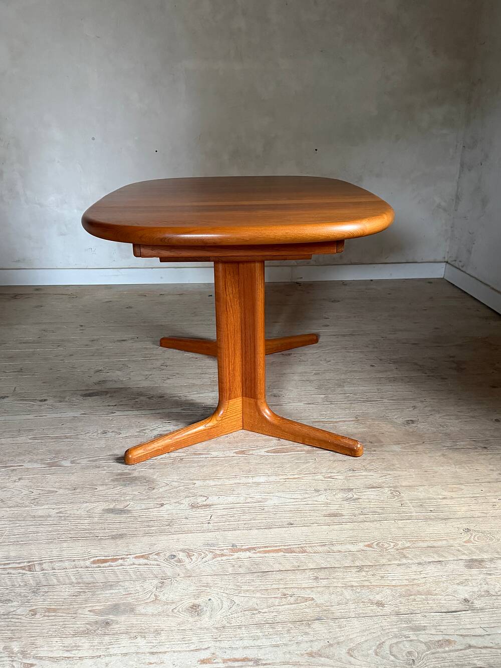 Vintage oval teak Scandinavian table with a central star base from Glostrup.