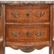 Small kidney-shaped chest of drawers in Transition style.