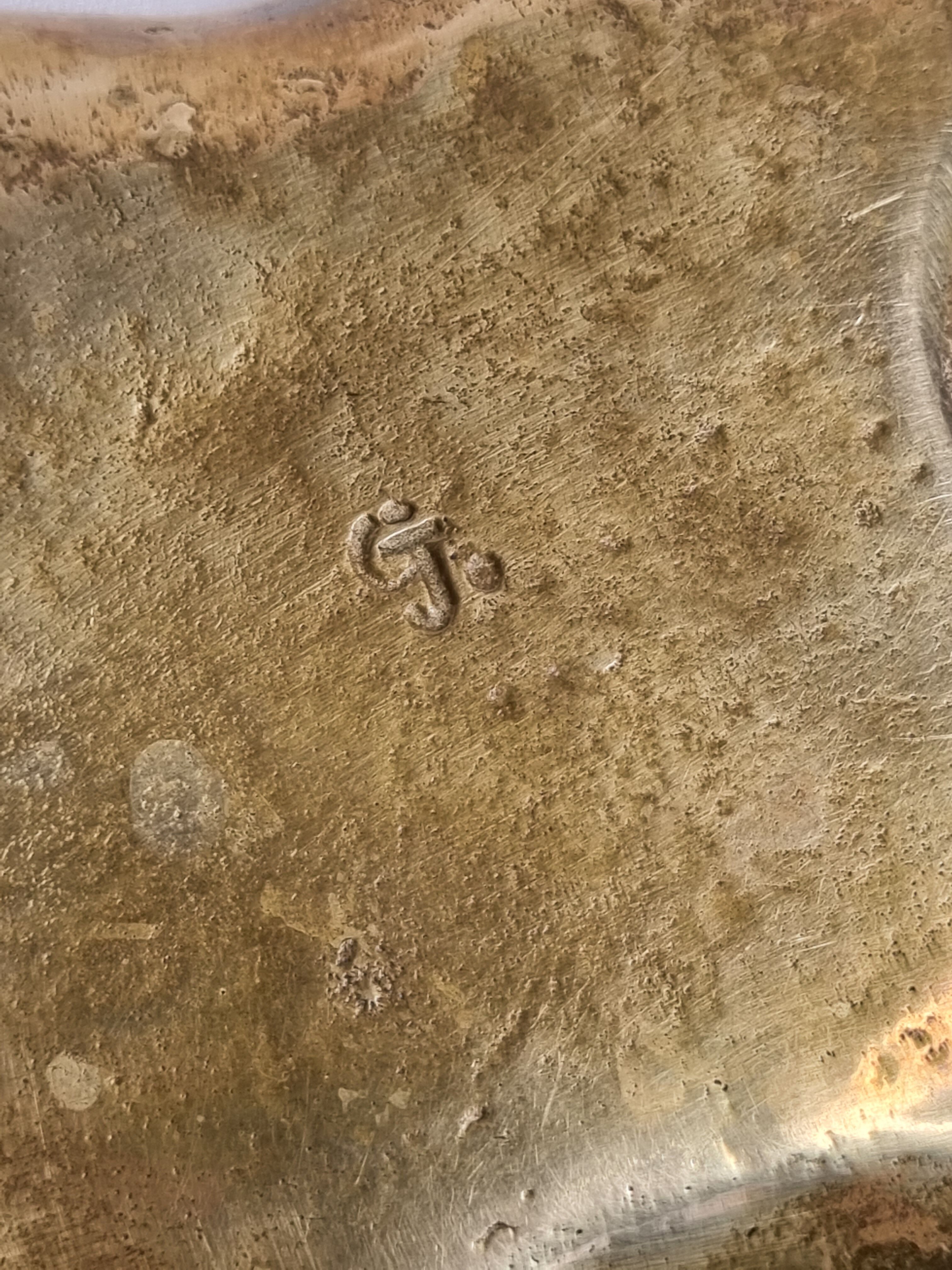 Empty pocket in polished brass representing a crumpled paper, signed CJ, 11.5 cm