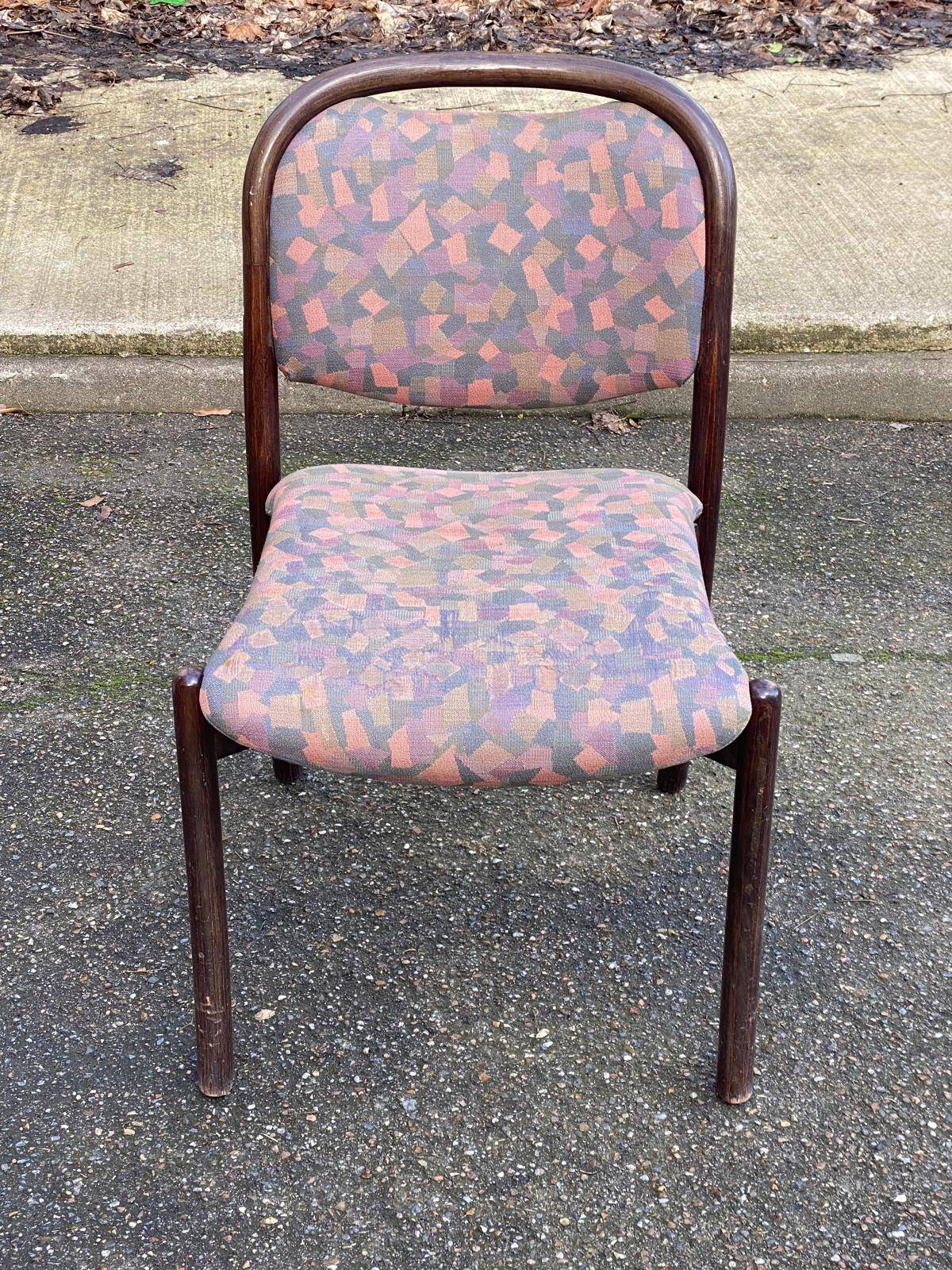 Scandinavian chair in curved solid teak wood and fabric.